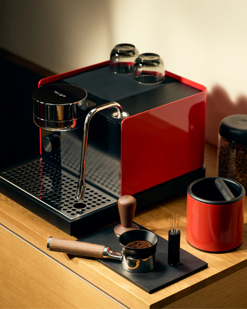 Cherry Red - Fellow Espresso Series 1 in Cherry Red with the sun lighting the machine and providing a great look vellutto.eu