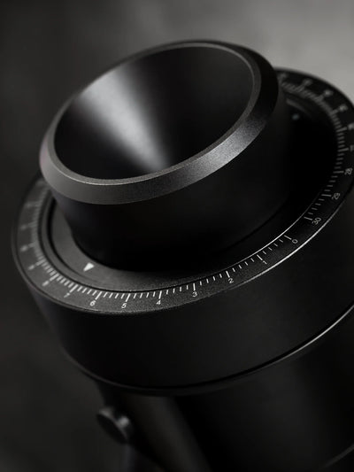 Close-up of the WPM ZP1 Single Dose Grinder's stepless grind collar, showcasing its sleek black design.